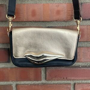 Diane Von Furstenberg black gold lip crossbody 8” L x5” tall like new with tags